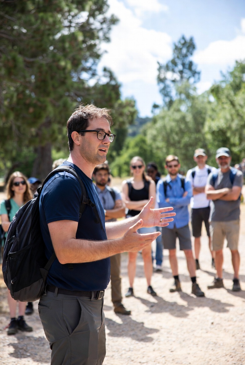 Experienced tour guide sharing local history with small group
